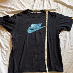 Nike Vintage Black T-Shirt with Light Blue Swoosh